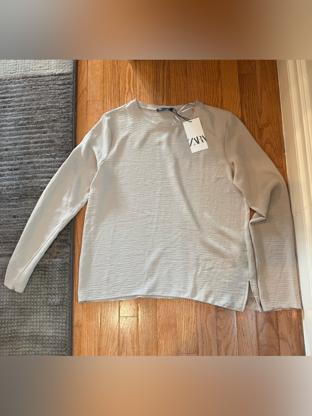 Zara New with tags cream long sleeve top with small stain on bottom